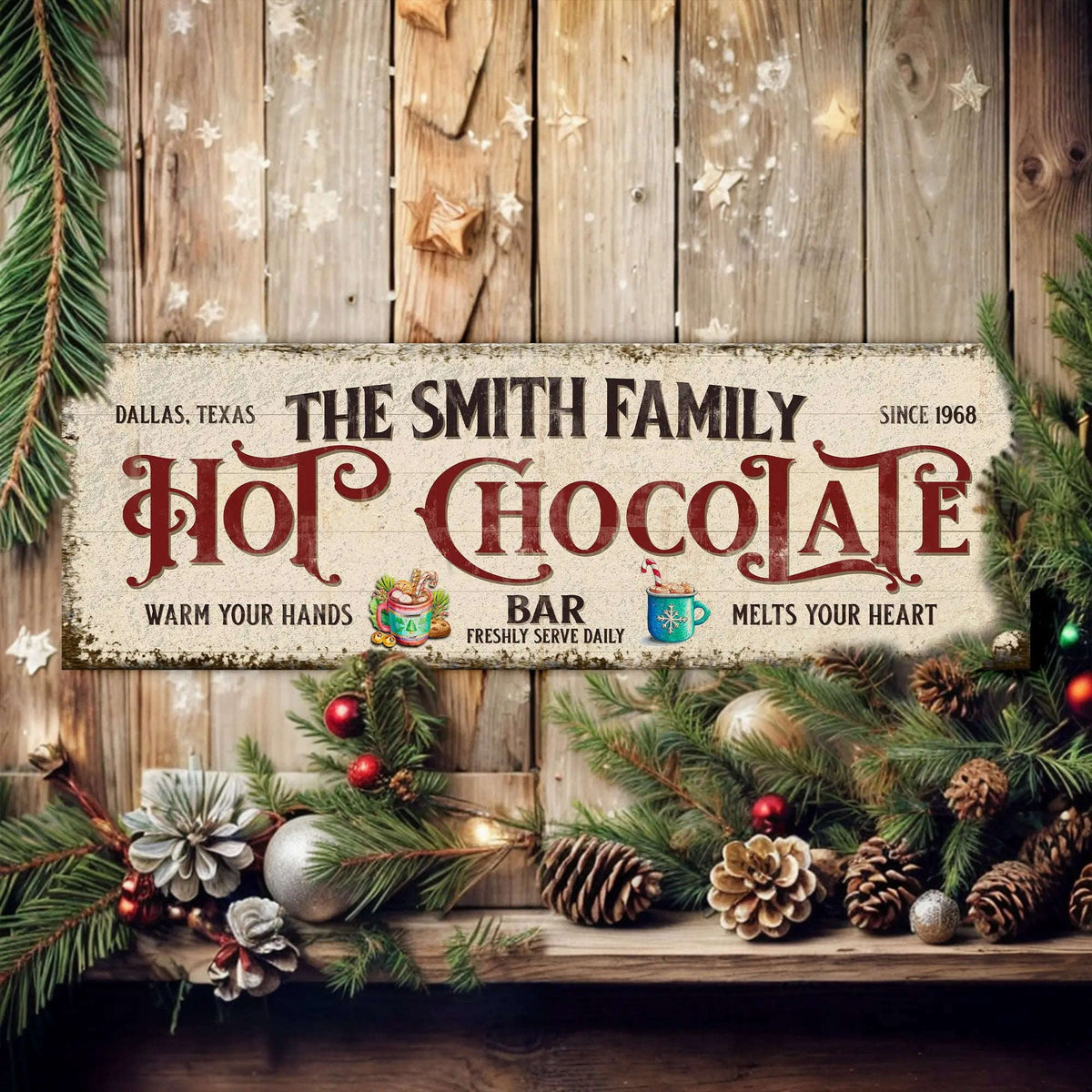 Holiday hot chocolate bar wall sign with greenery and pinecones on wooden boards