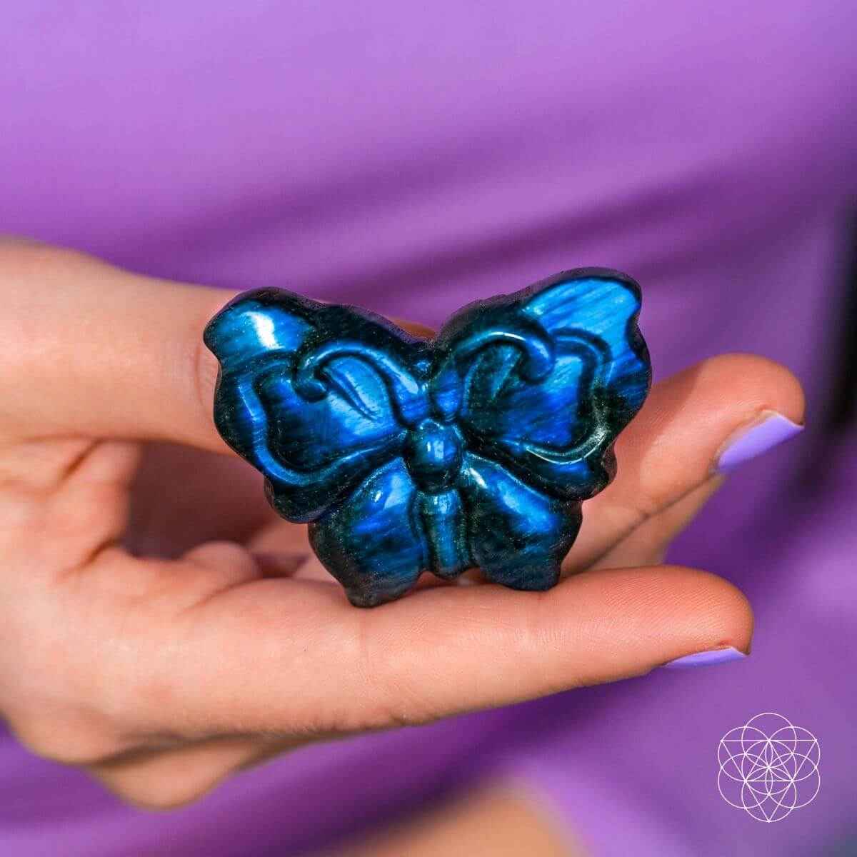 Blue labradorite butterfly carving with glossy iridescent finish