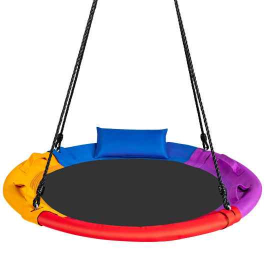 Multicolor round platform swing with blue pillow and rope handles, black seat