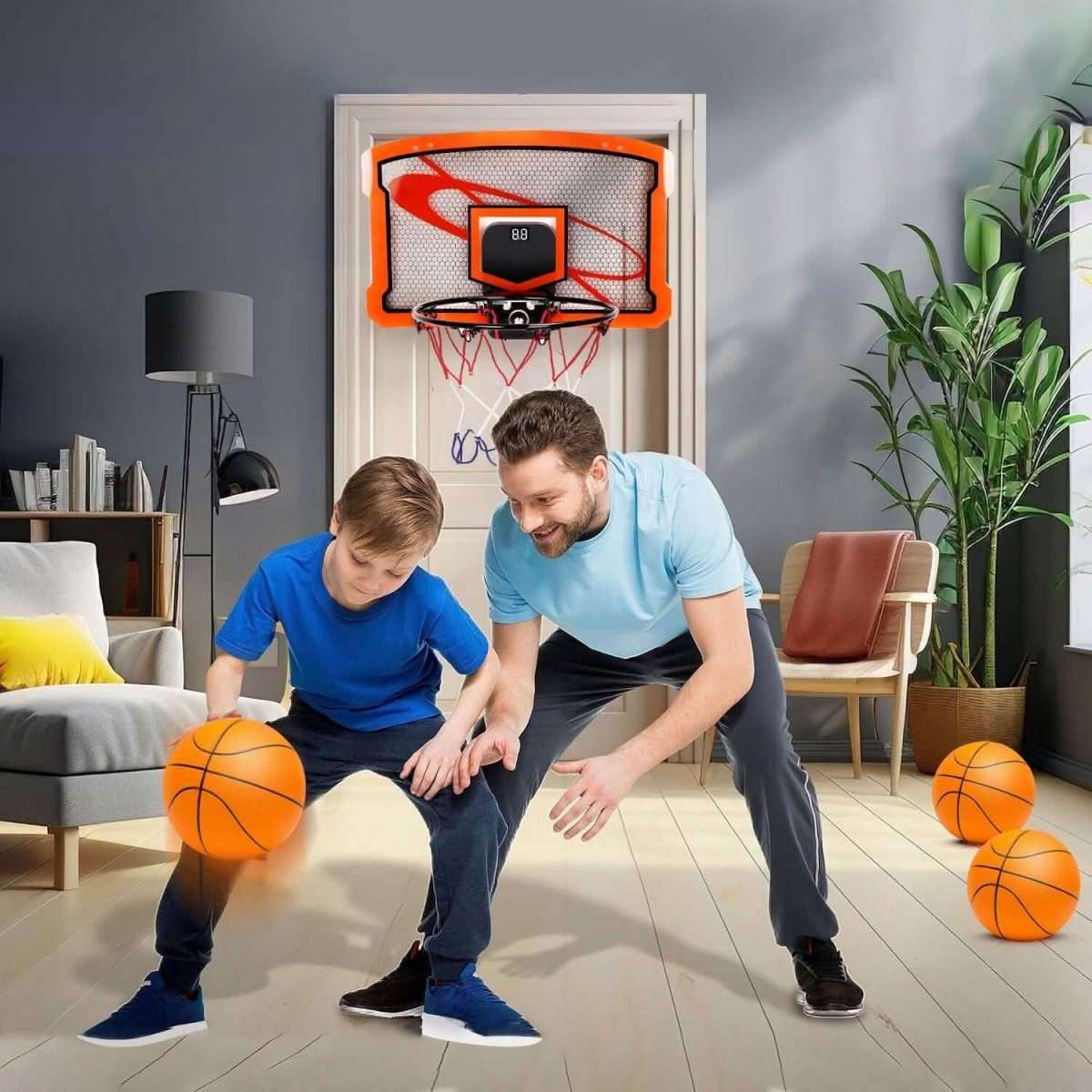 Indoor mini basketball hoop with orange frame, net, and digital scorer; 2 orange balls
