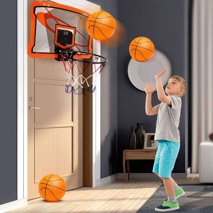 Indoor mini basketball hoop with orange frame and net; child shooting with orange inflatable ball