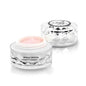 Eye cream jar with faceted clear container and pink cream inside, white lid top