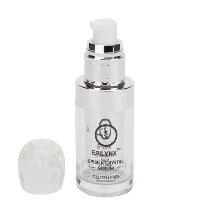 Face serum bottle with white cap and small light cream jar