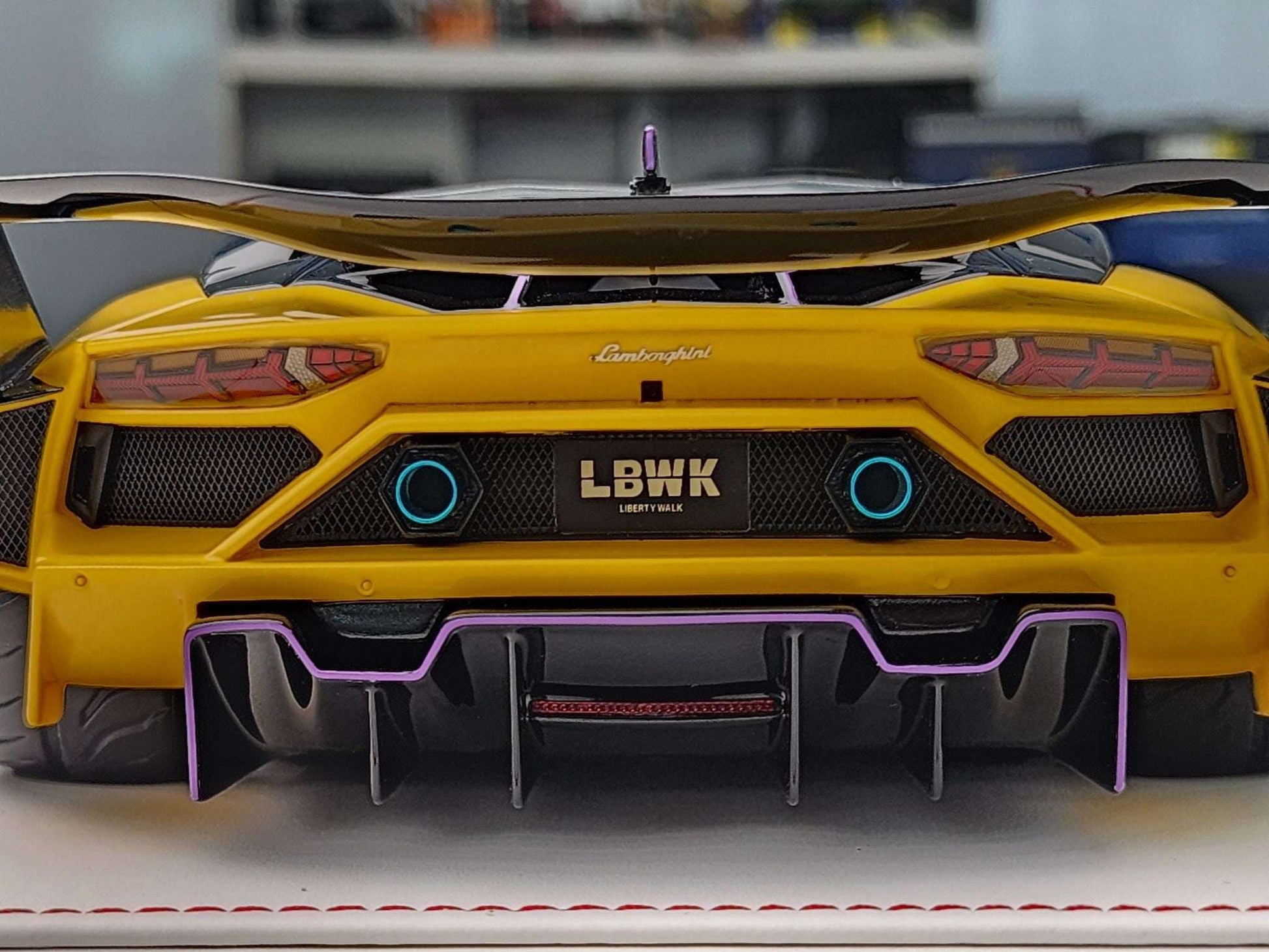 Yellow Lamborghini Aventador GT die-cast model with LBWK plate and purple rear diffuser
