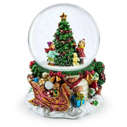 Joyful Children Adorning Christmas Tree: Musical Water Snow Globe Cartsfy Inc.