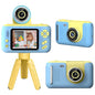 Blue kids digital camera with flip lens on tripod and handheld camera body, screen visible