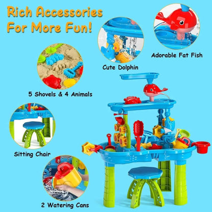 Kids sand and water table with blue top, red fish figure, shovels, and watering cans