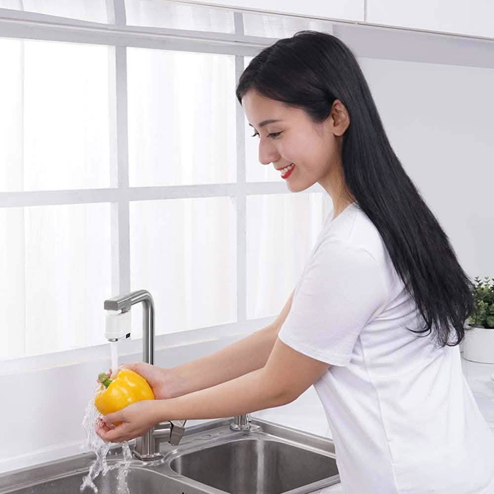 Automatic sensor kitchen sink faucet with chrome spout over stainless basin in use