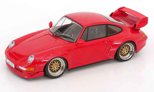 Red die-cast Porsche 911 GT2 model with gold wheels, front three-quarter view