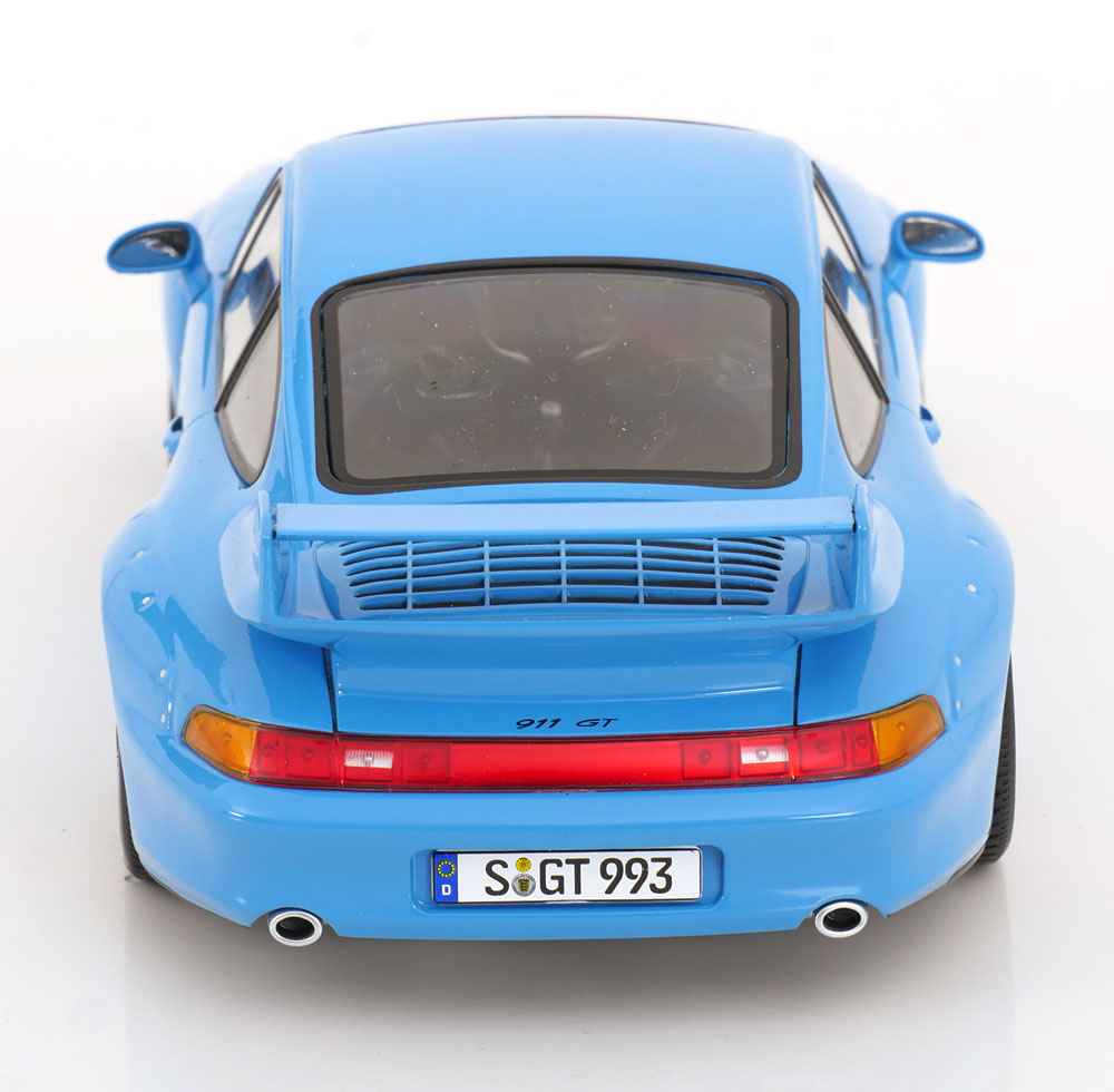 Blue 1:18 scale Porsche GT2 model car rear view with red taillights and vents