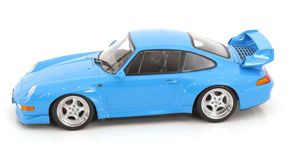 Blue 1:18 scale Porsche GT2 model car in three-quarter view with rear spoiler