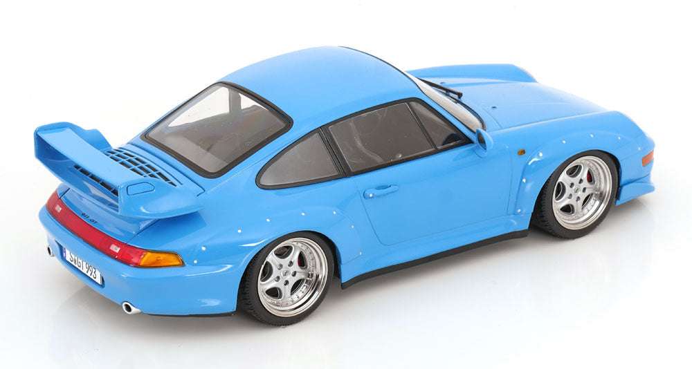 Blue 1:18 scale Porsche GT2 model car, side view with detailed silver wheels