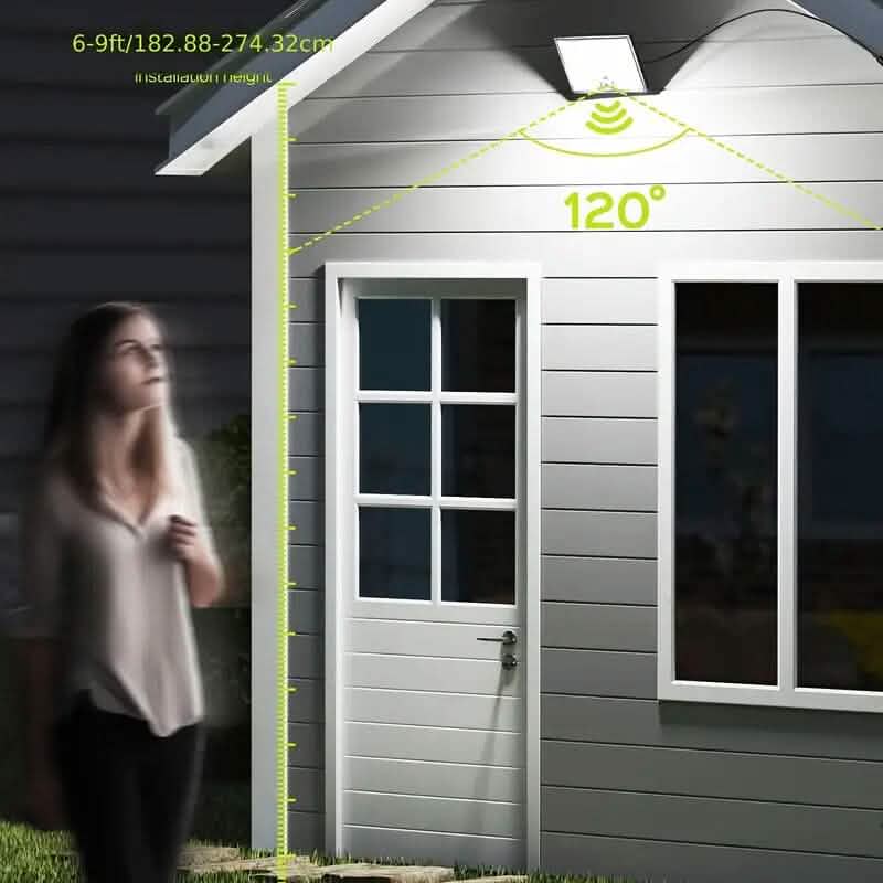 Solar LED motion floodlight providing wide-angle illumination near a doorway