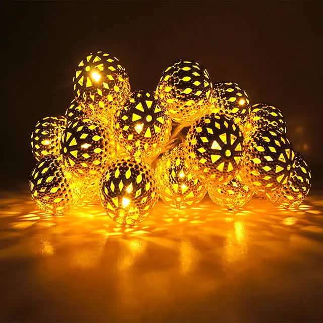 LED solar string lights with warm white globe bulbs on a short wire strand