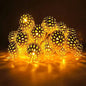 LED solar string lights with warm white globe bulbs on a short wire strand