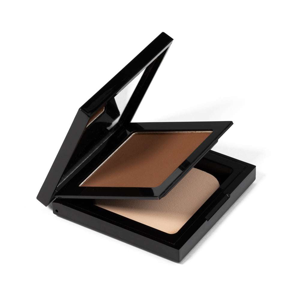 Matte powder foundation compact, open black case with rich brown powder block