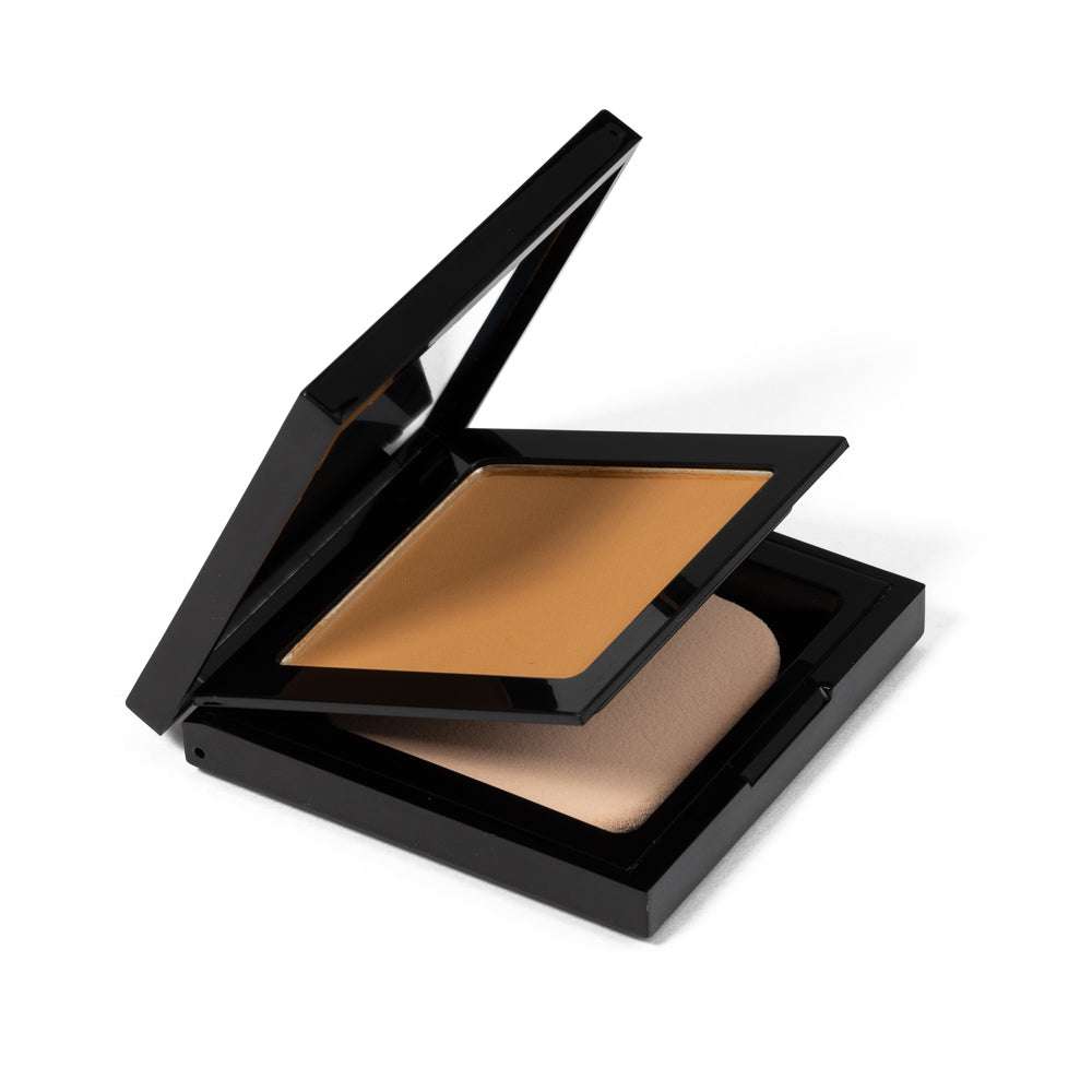 Luminous Matte Powder Foundation compact with angled lid over beige powder pan