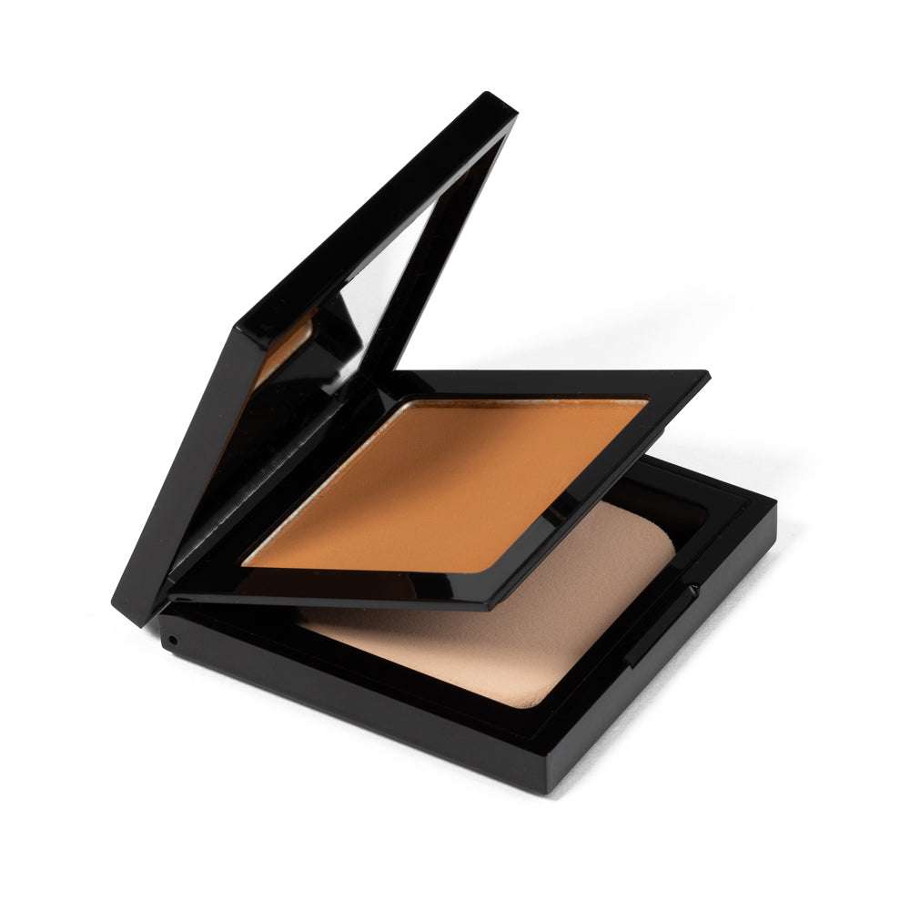 Matte powder foundation compact, open lid, golden tan powder in black case