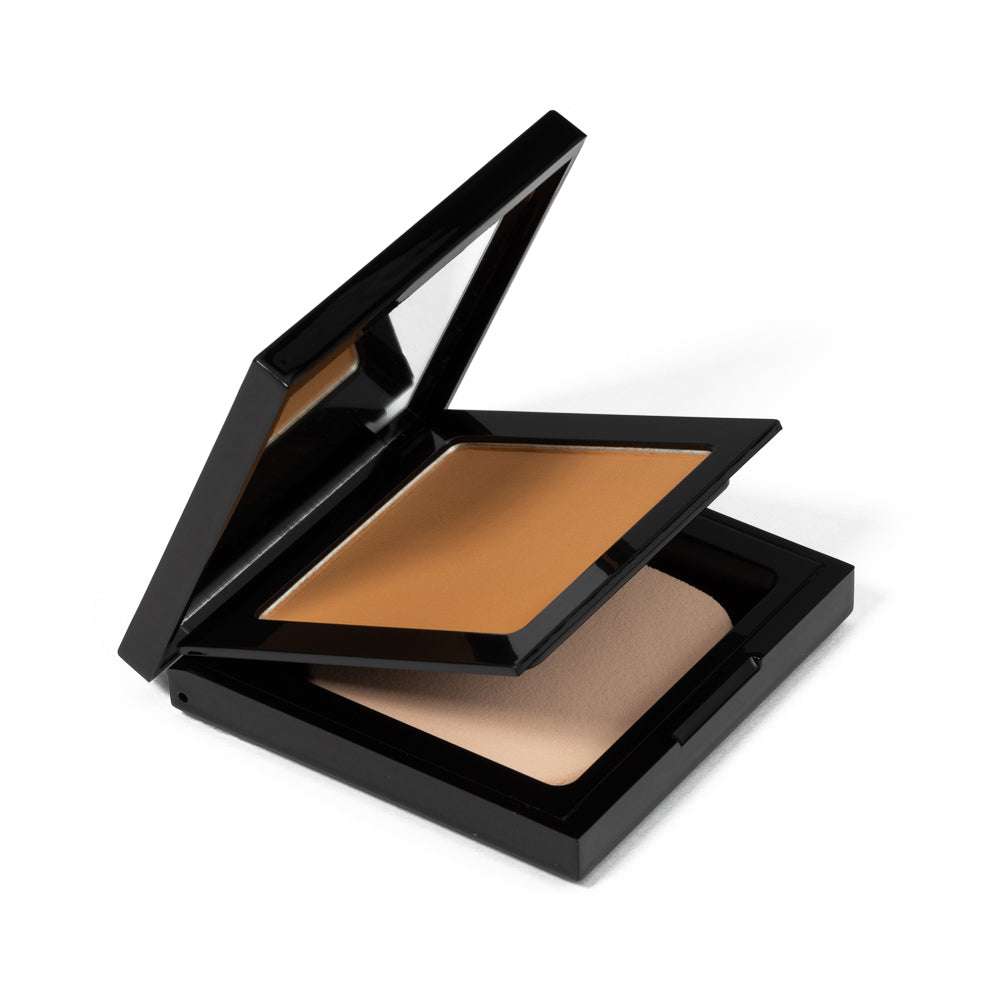Matte powder foundation compact, open lid, warm tan powder in black case