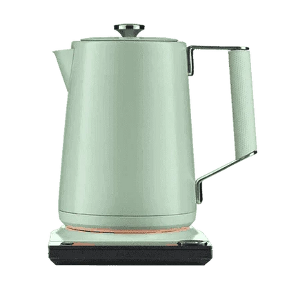 Sage green electric kettle with side handle and illuminated heating base ring.
