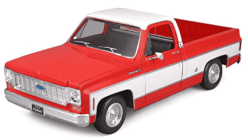 1:18 scale red and white Chevrolet C-10 pickup die-cast model, front-side view