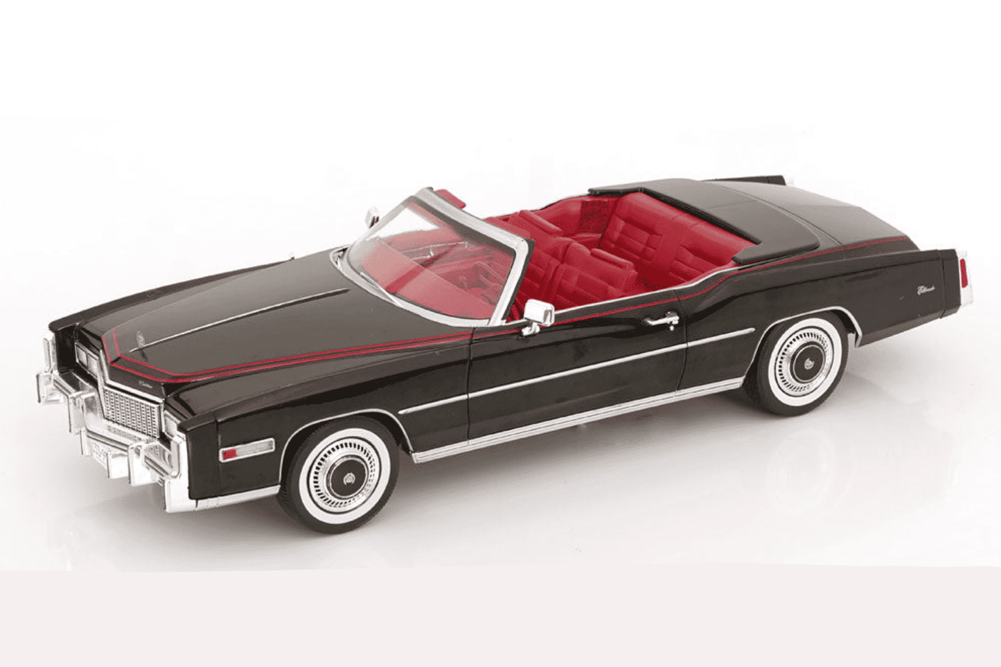Black 1976 convertible model car with red interior, chrome bumpers, white pinstripe, 1:18