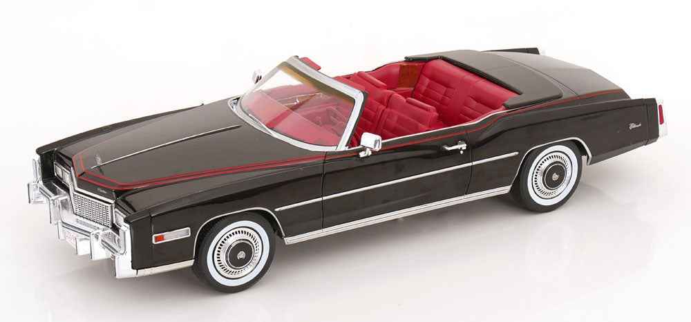 Black convertible model car with red interior, white pinstripe, angled side view, 1:18 scale