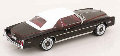 Black convertible model car with red interior, white pinstripe, side view, chrome wheels