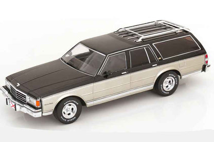 Grey and silver station wagon die-cast model with black hood and roof rack