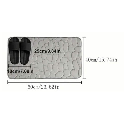 Rectangular bath rug with cobblestone embossing and size diagram markings