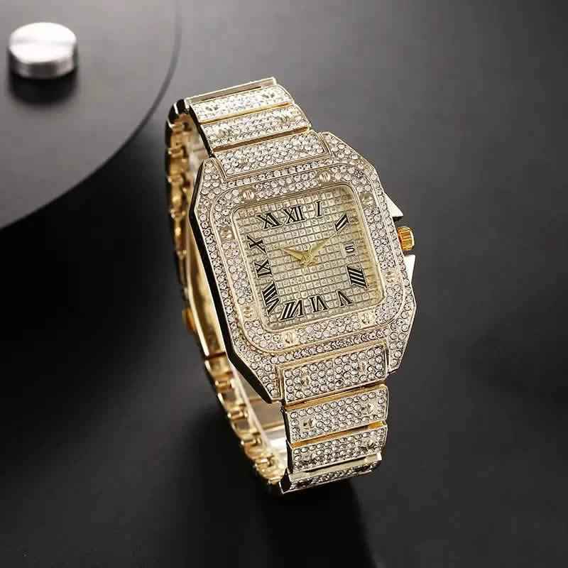 Gold rhinestone analog watch with Roman numerals, rectangular case, link bracelet
