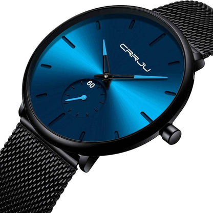Close-up blue minimalist wrist watch with black mesh band, blue dial and teal hands