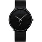 Black round wrist watch with minimalist markers and black mesh strap