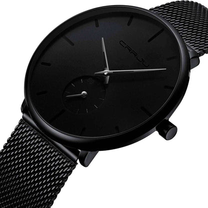 Men's minimalist waterproof wrist watch with black case and mesh strap, close-up of black dial