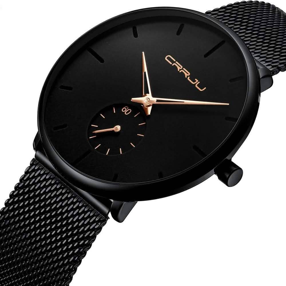 Minimalist black wrist watch with black mesh strap and gold hands, small subdial on dial