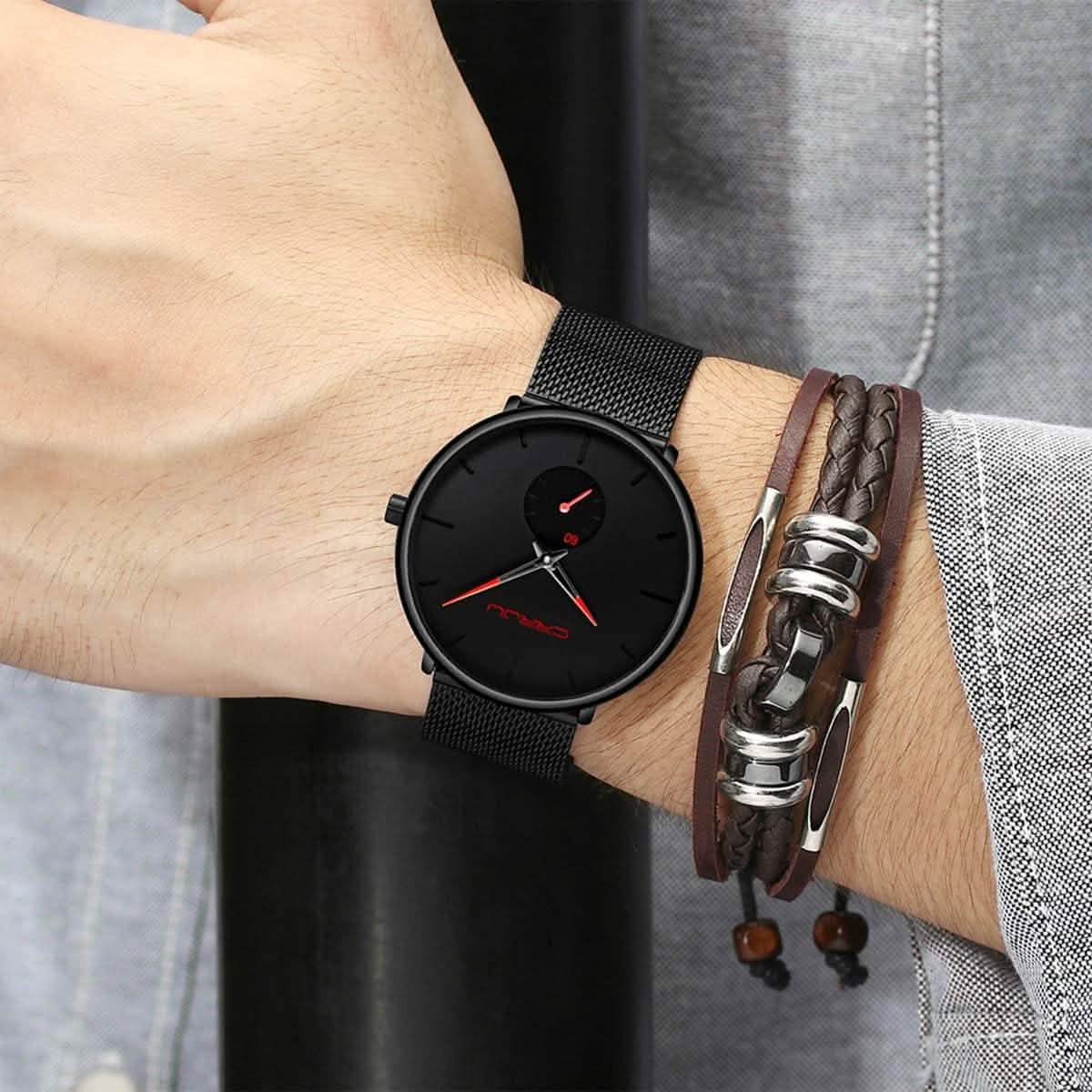 Minimalist black wrist watch on black mesh strap, black dial with red hands