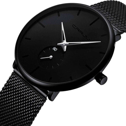Black round wrist watch with black dial and mesh metal strap, angled view