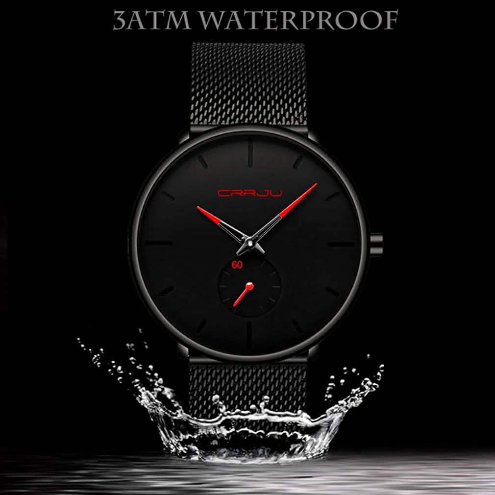 Minimalist black wrist watch with black mesh strap, black dial, red hands and subdial