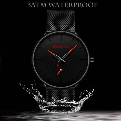 Minimalist black wrist watch with black mesh strap, black dial, red hands and subdial