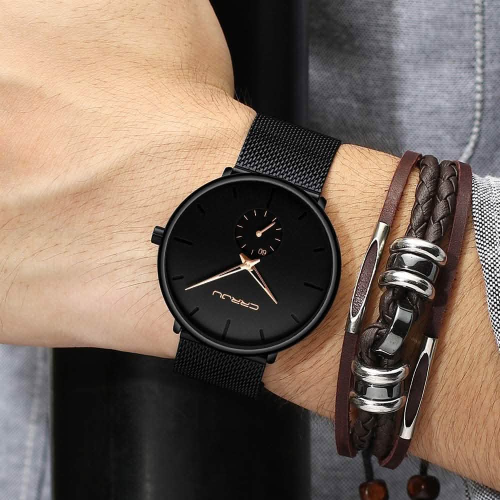 Minimalist black wrist watch with mesh strap, black dial, gold hands and small subdial