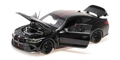 Black die-cast BMW M4 CSL coupe with red stripes, hood open, front 3/4 view