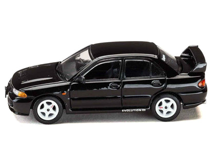 Black diecast Lancer Evolution III car, three-quarter front side view