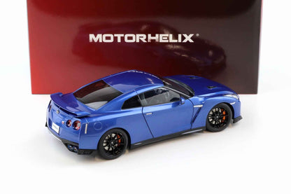 Blue die-cast sports car model, rear three-quarter view with black wheels