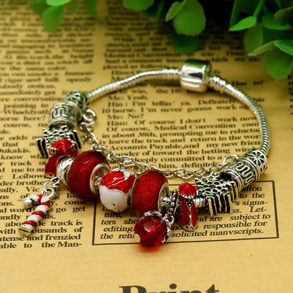 Red crystal Christmas charm bracelet close-up with Santa, stocking and bell charms