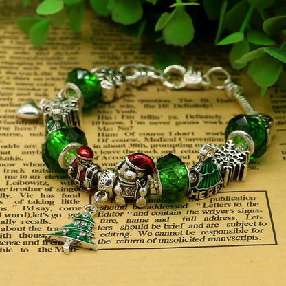Green crystal Christmas charm bracelet close-up with Santa and tree charms