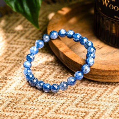 Blue kyanite bead bracelet with round stones on burlap fabric
