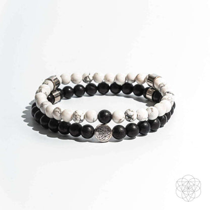 Beaded bracelet set with alternating black and white beads and silver-toned spacer beads