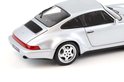 Silver Porsche 911 die-cast model car close-up, rear lights, grille, and four-spoke wheel