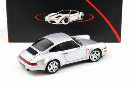 Silver Porsche 911 die-cast model car, rear three-quarter view with rear spoiler and four-spoke wheels