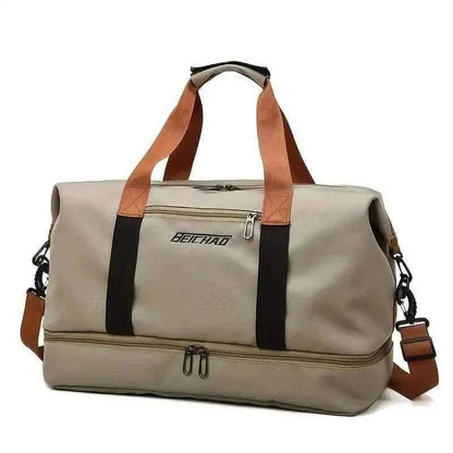 Nylon duffel bag in beige with black stripe and tan handles, front zip pocket.